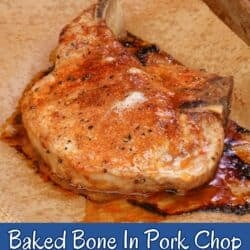 one baked bone in pork chop with homemade pork chop seasoning on a baking sheet.
