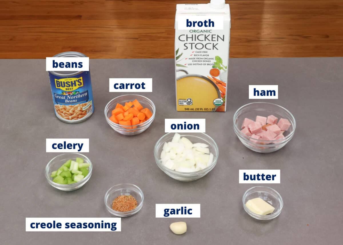ingredients in a small batch ham and bean soup recipe assembled on a kitchen counter.