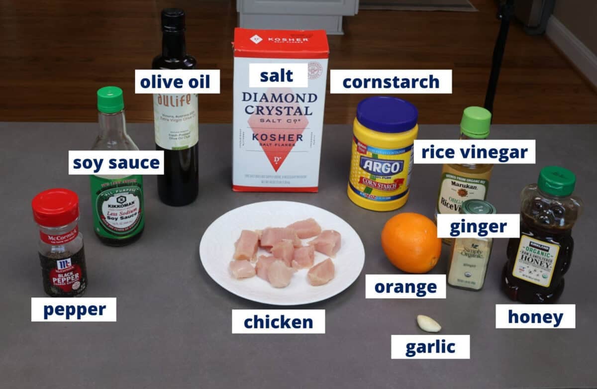 ingredients in orange chicken assembled on a kitchen counter.