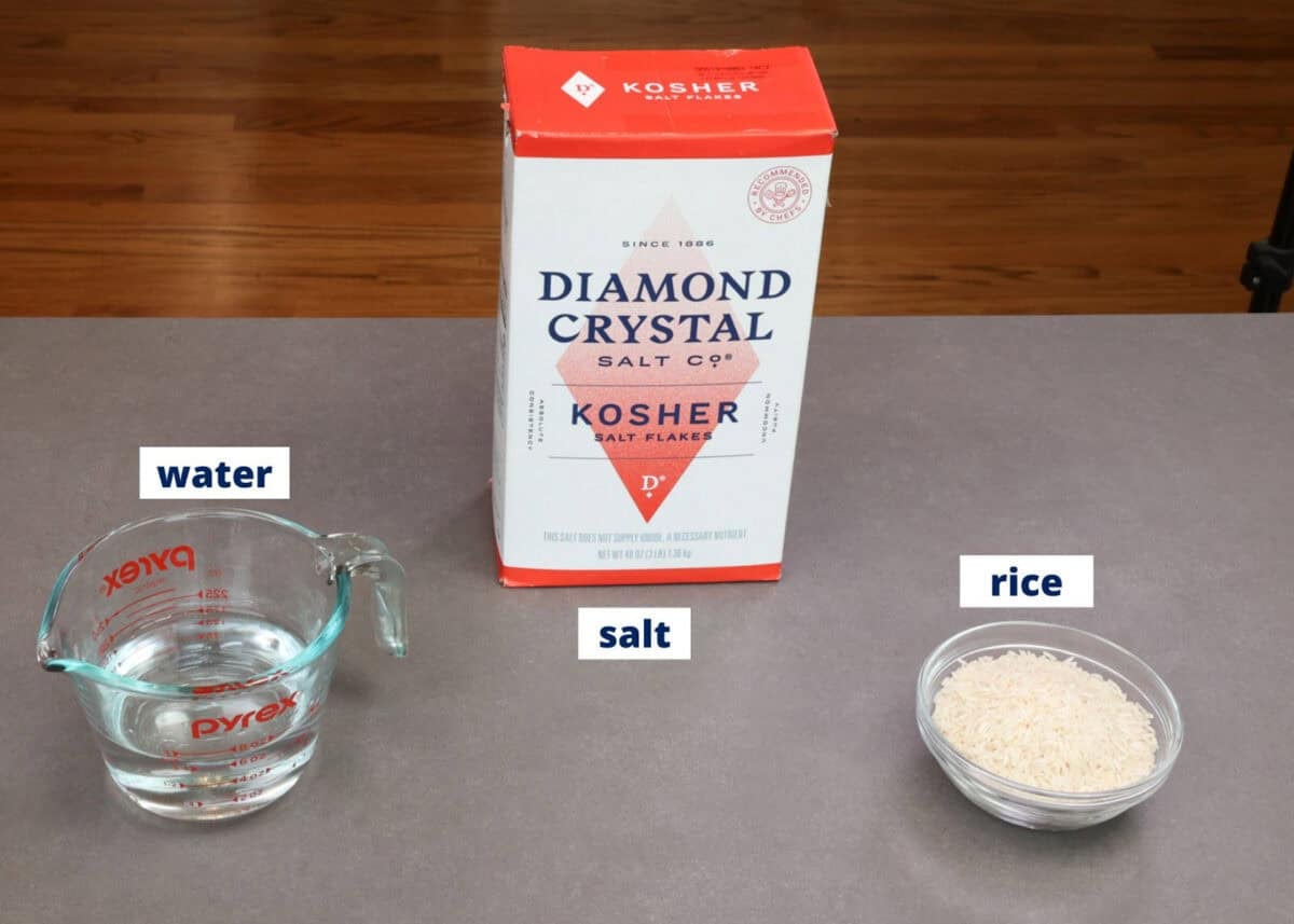 ingredients needed to cook rice on a kitchen counter.