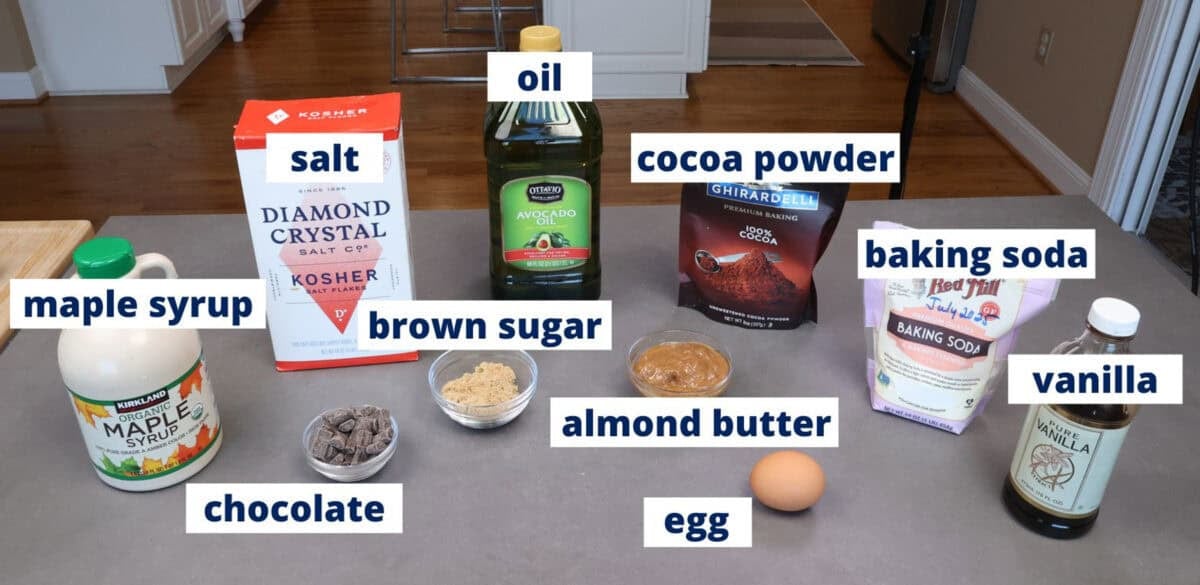 ingredients in small batch chocolate flourless brownies on a kitchen table.