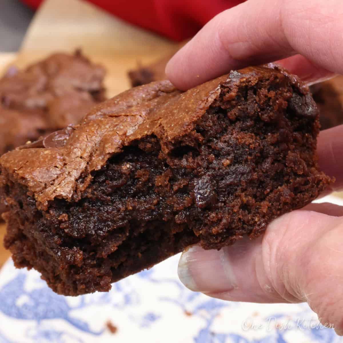 a partially eaten double chocolate flourless brownie.