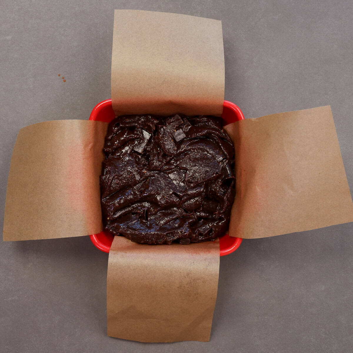 flourless chocolate brownie batter poured into a small baking dish.