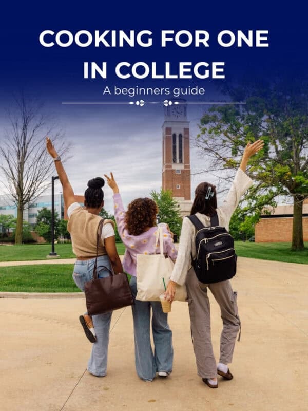 three college students in front of their dorm.